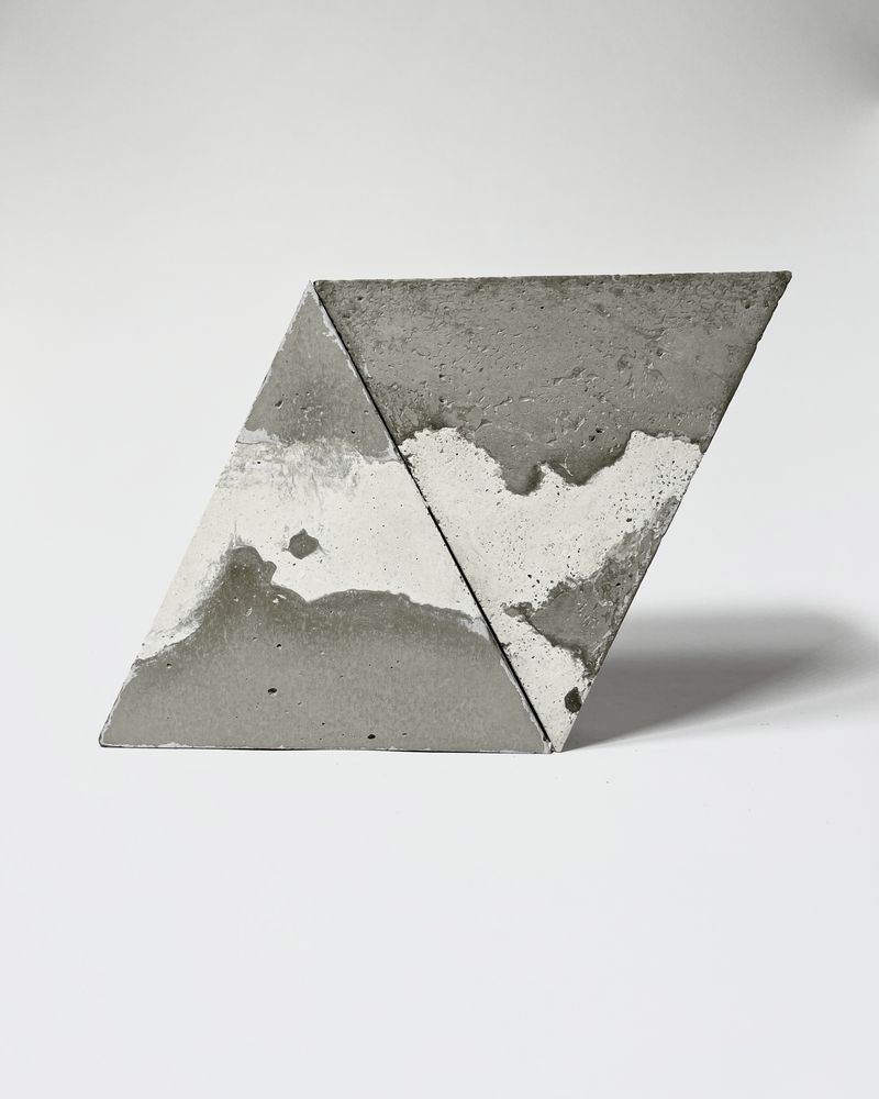 Two concrete triangles with a marbled pattern
